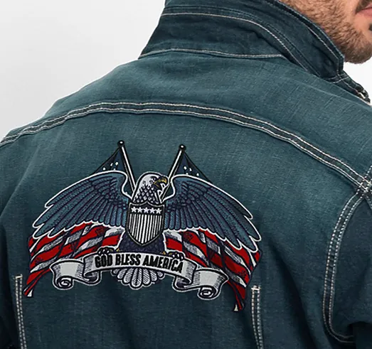 Eagle with flag-pattern wings and a God Bless America banner embroidered on the back of a denim jacket